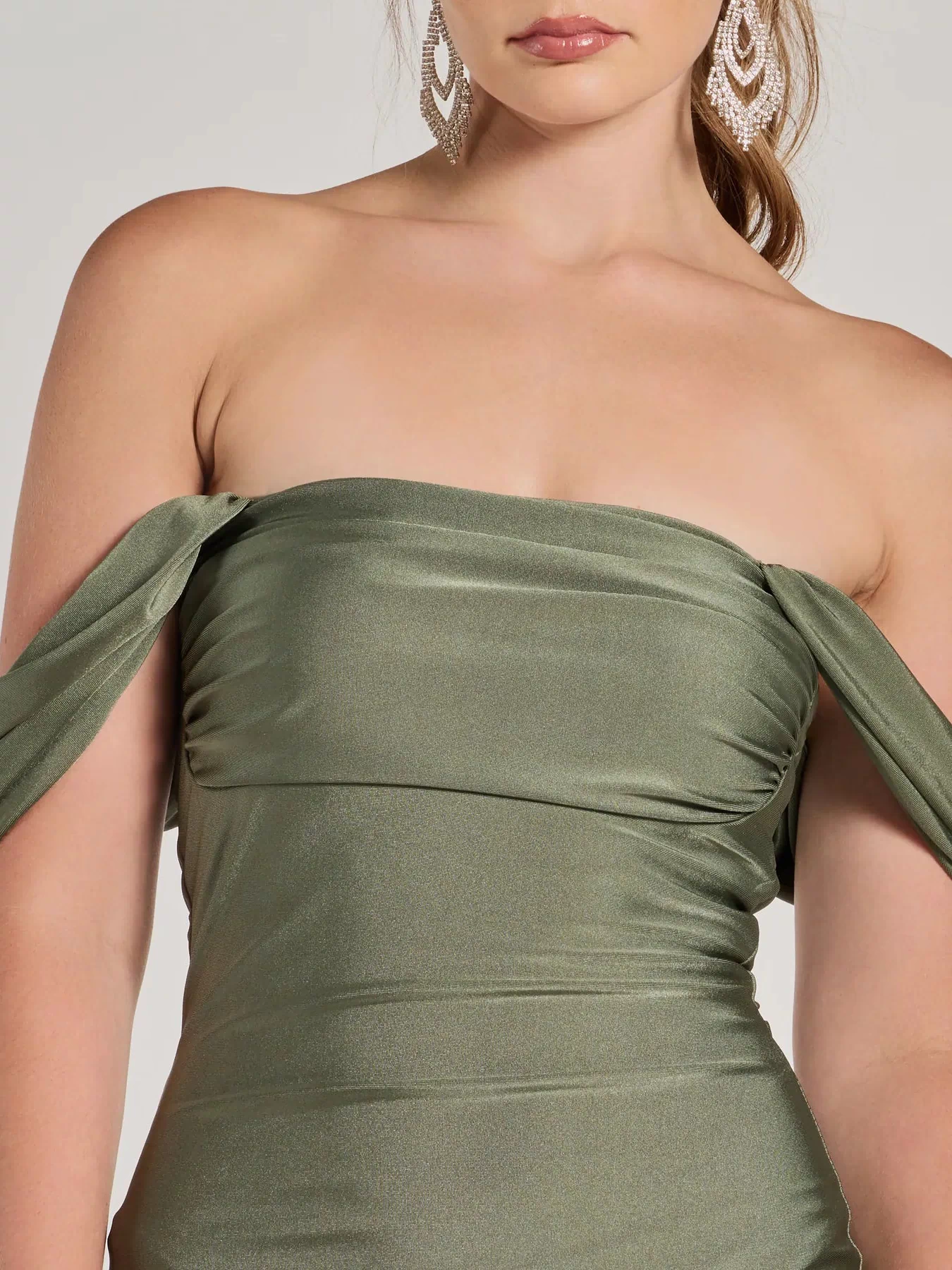 Make a bold statement in the Exceptional Off-The-Shoulder Flared Midi Dress in sage green, the perfect green dress for weddings, cocktail hours, nights out, and/or seasonal celebrations.
