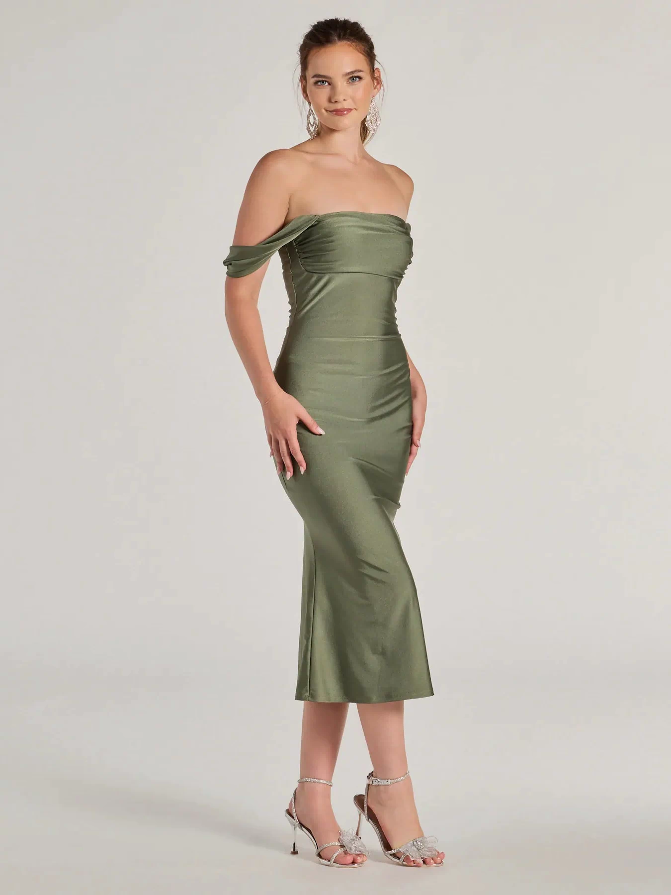 Whether it's the color or silhouette of the Exceptional Off-The-Shoulder Flared Midi Dress, this sage bridesmaid dress is a gorgeous pick for a maid-of-honor or to create a bridal party look ready to celebrate!