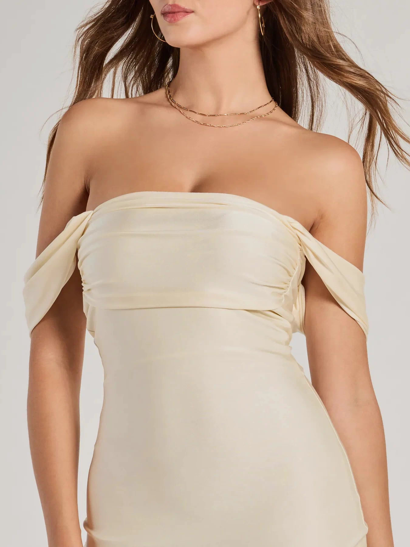 Make a bold statement in the Exceptional Off-The-Shoulder Flared Midi Dress in natural, the perfect Windsor dress for cocktail hours, nights out, and/or seasonal celebrations.