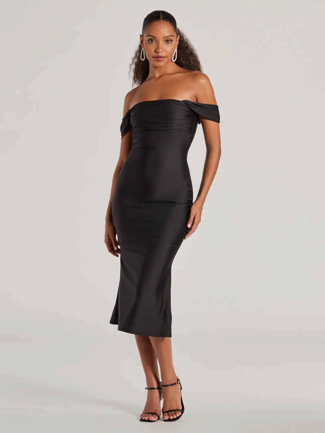 The Exceptional Off-The-Shoulder Flared Midi Dress is your new go-to black dress—effortless, versatile, and made to update your spring or summer style in seconds.