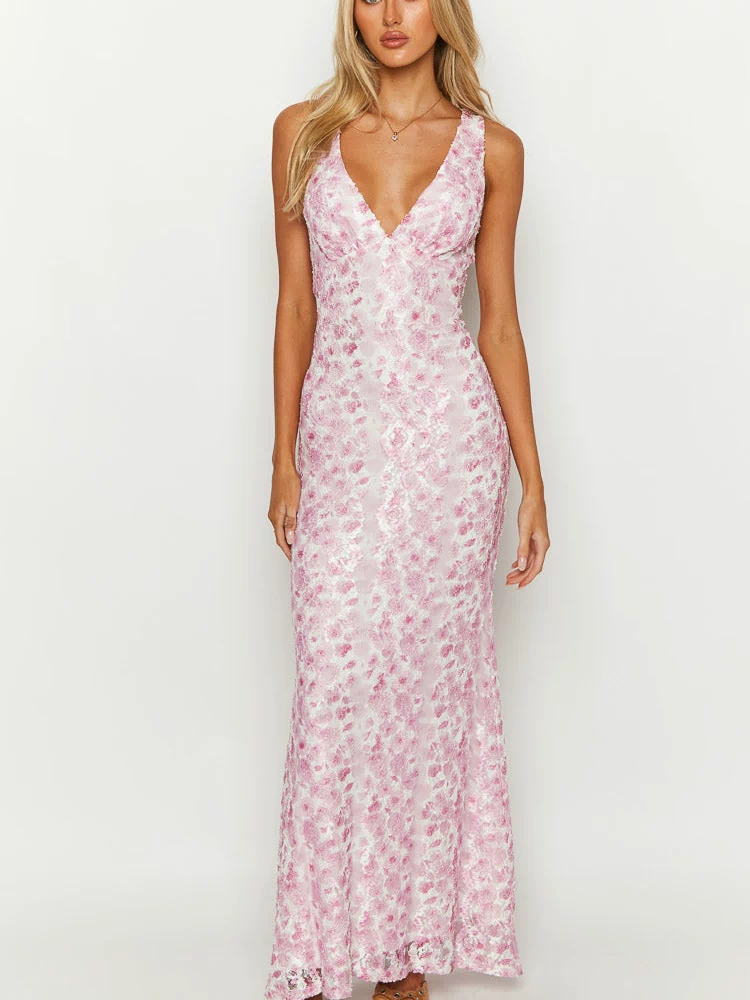 Pink floral lace maxi dress with a deep V-neckline and a fitted silhouette, flowing slightly at the hem