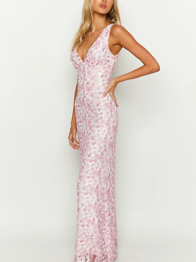 Side view of a fitted pink floral lace maxi dress, showing the full length of the intricate pattern