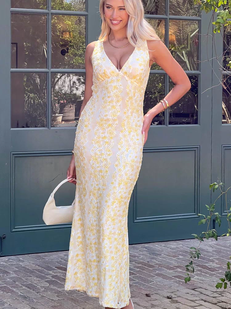 Front view of a yellow lace maxi dress with a V-neckline and fitted silhouette