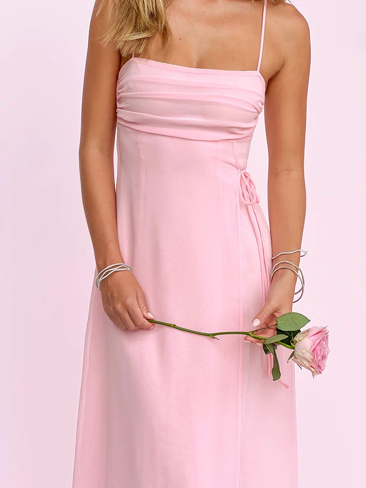 Pink sleeveless maxi dress with a ruched straight neckline and adjustable side tie detail