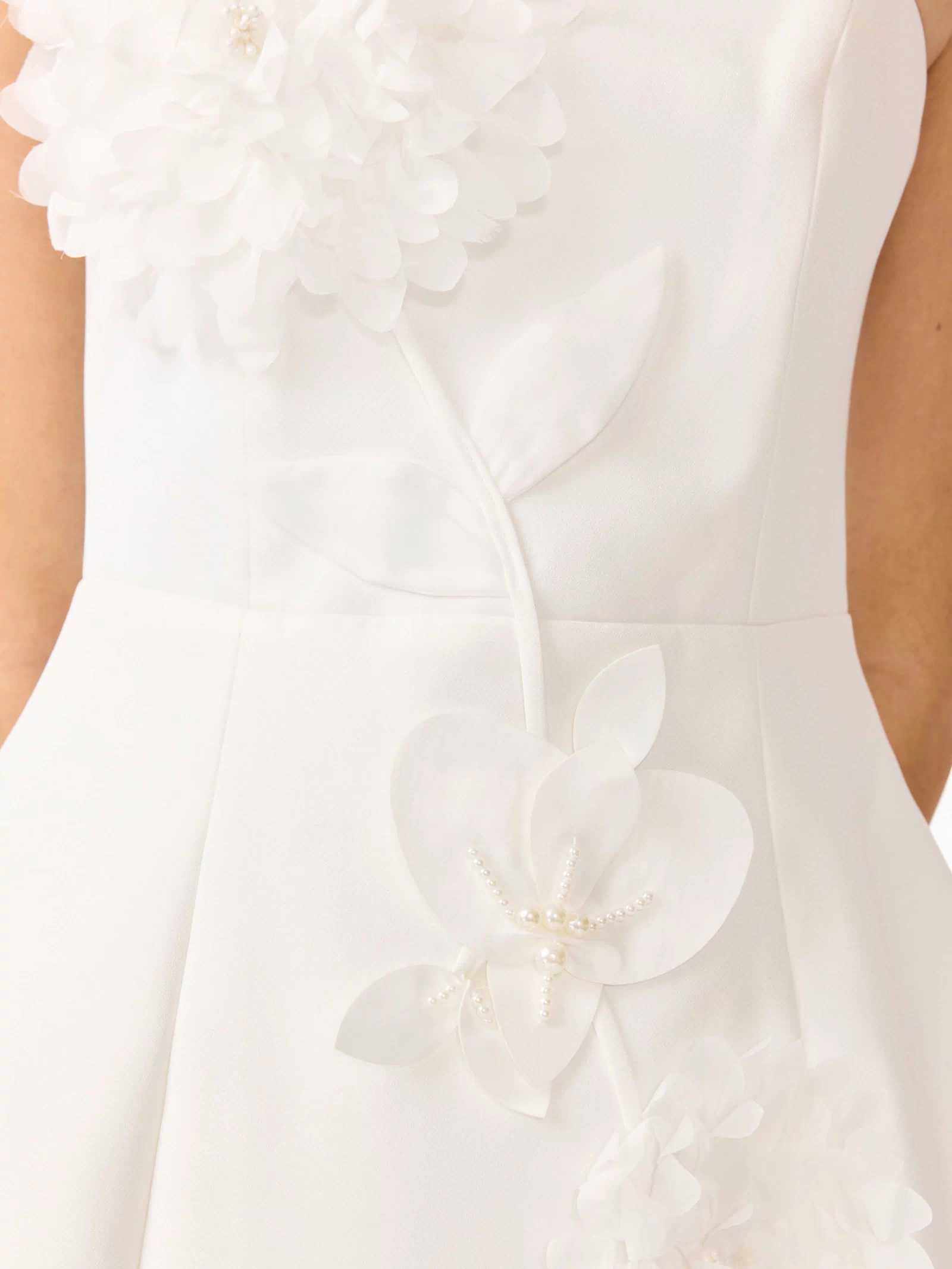Gemma Floral Mini Dress in White with a strapless neckline, tulip skirt & floral appliques detail shot