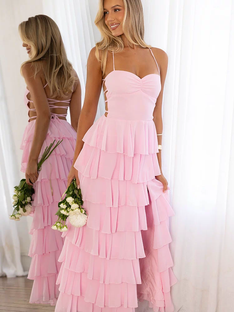 Pink tiered ruffle maxi dress with sweetheart neckline, side cutouts, and criss-cross back lacing