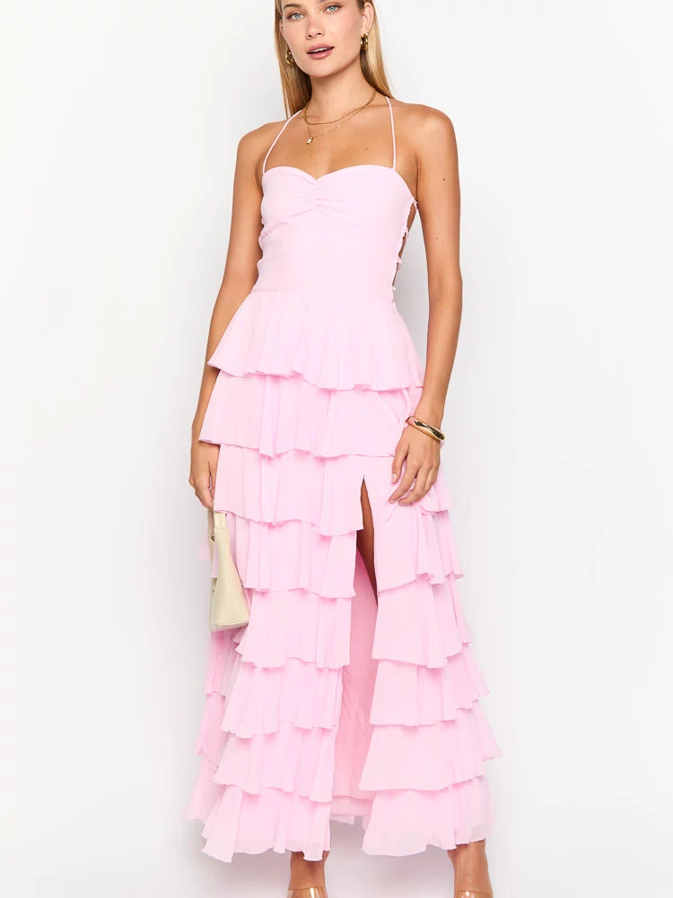 Pink halter neck maxi dress with a ruched bust, tiered ruffles, and a high side slit
