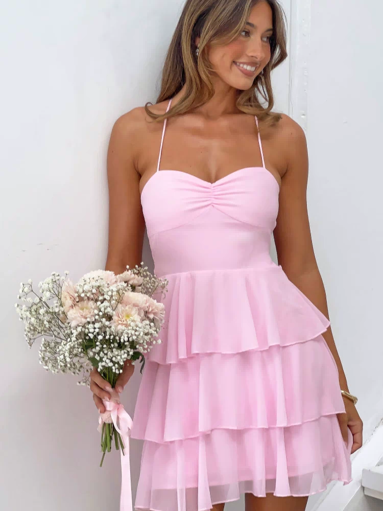 Pink mini dress with a ruched sweetheart bust and three-tiered sheer ruffle skirt