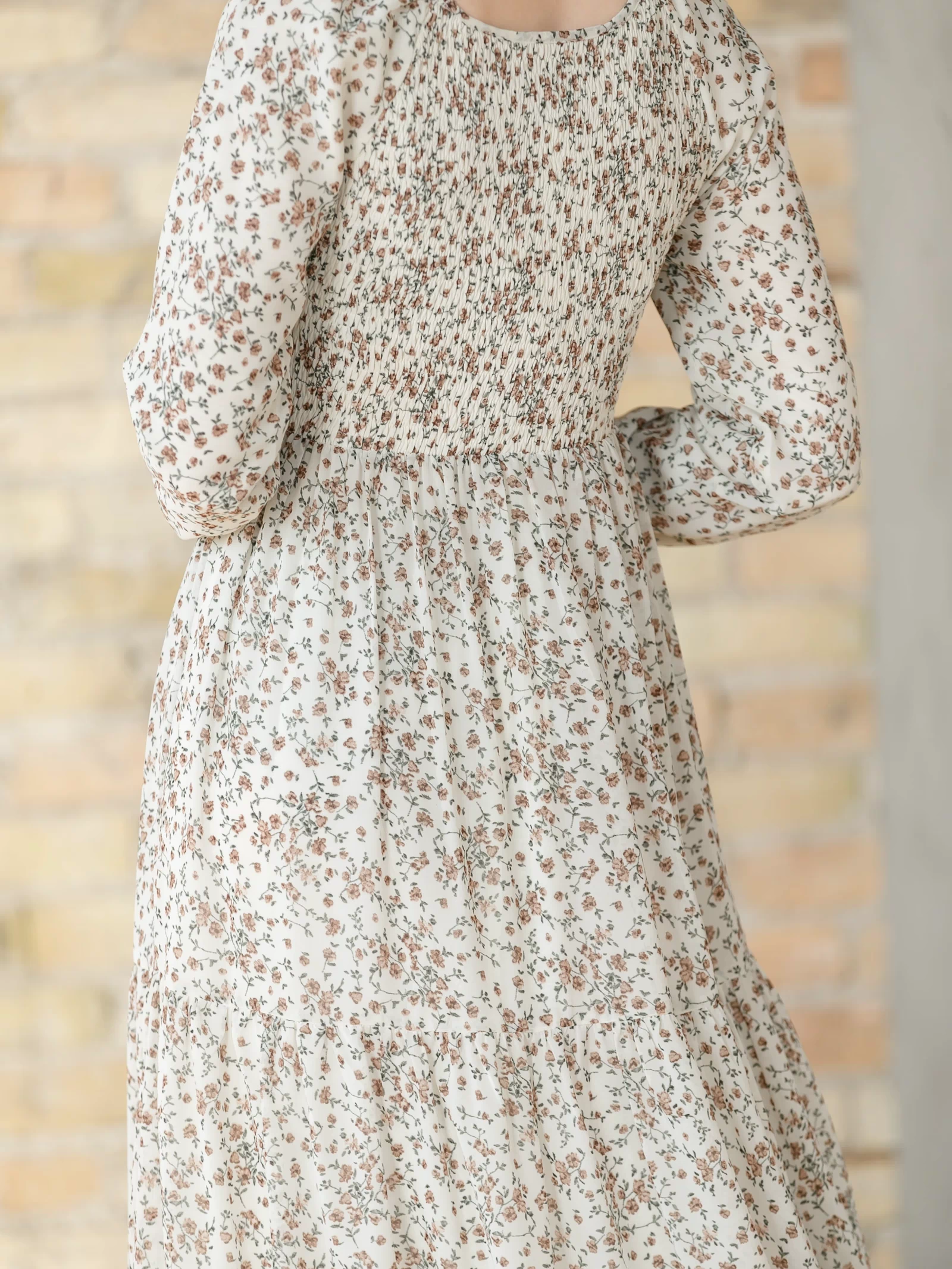 Floral dress with long sleeves  showing the smocked back.