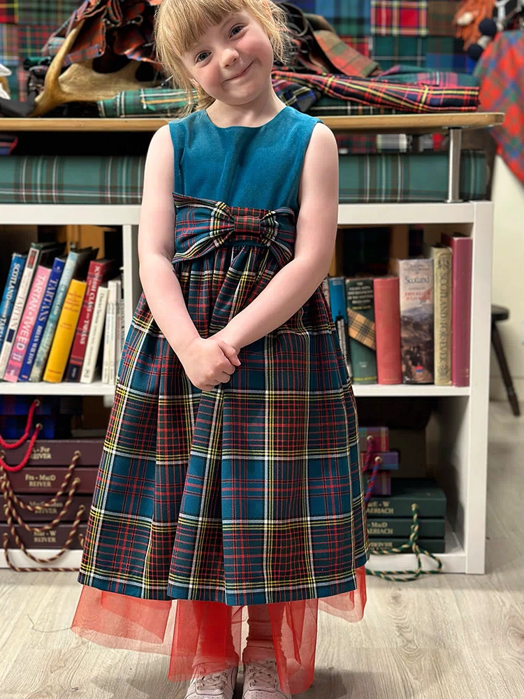 Girls Tartan and Velvet Dress (age 2 - 10) featuring a beautiful tartan pattern and luxurious velvet fabric, perfect for special occasions.
