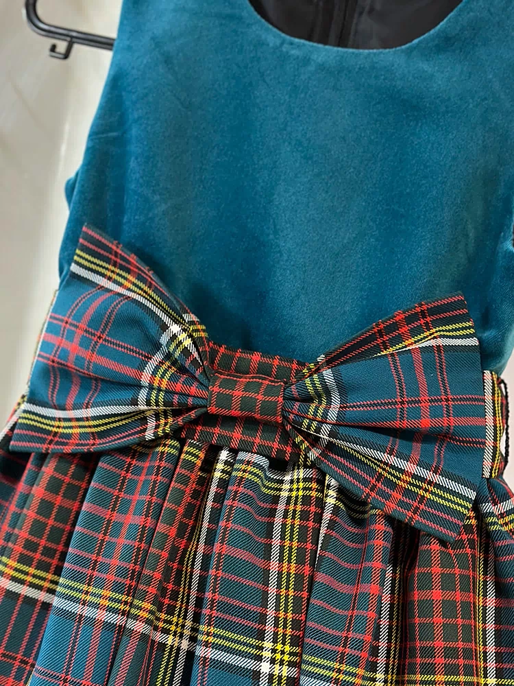 Close-up of the Girls Tartan and Velvet Dress (age 2 - 10) highlighting the quality wool tartan and elegant velvet top.