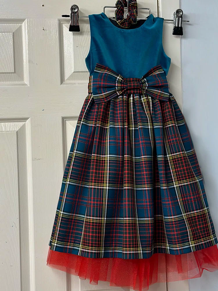 Girls Tartan and Velvet Dress (age 2 - 10) displayed with optional matching tartan scrunchie for a complete look.