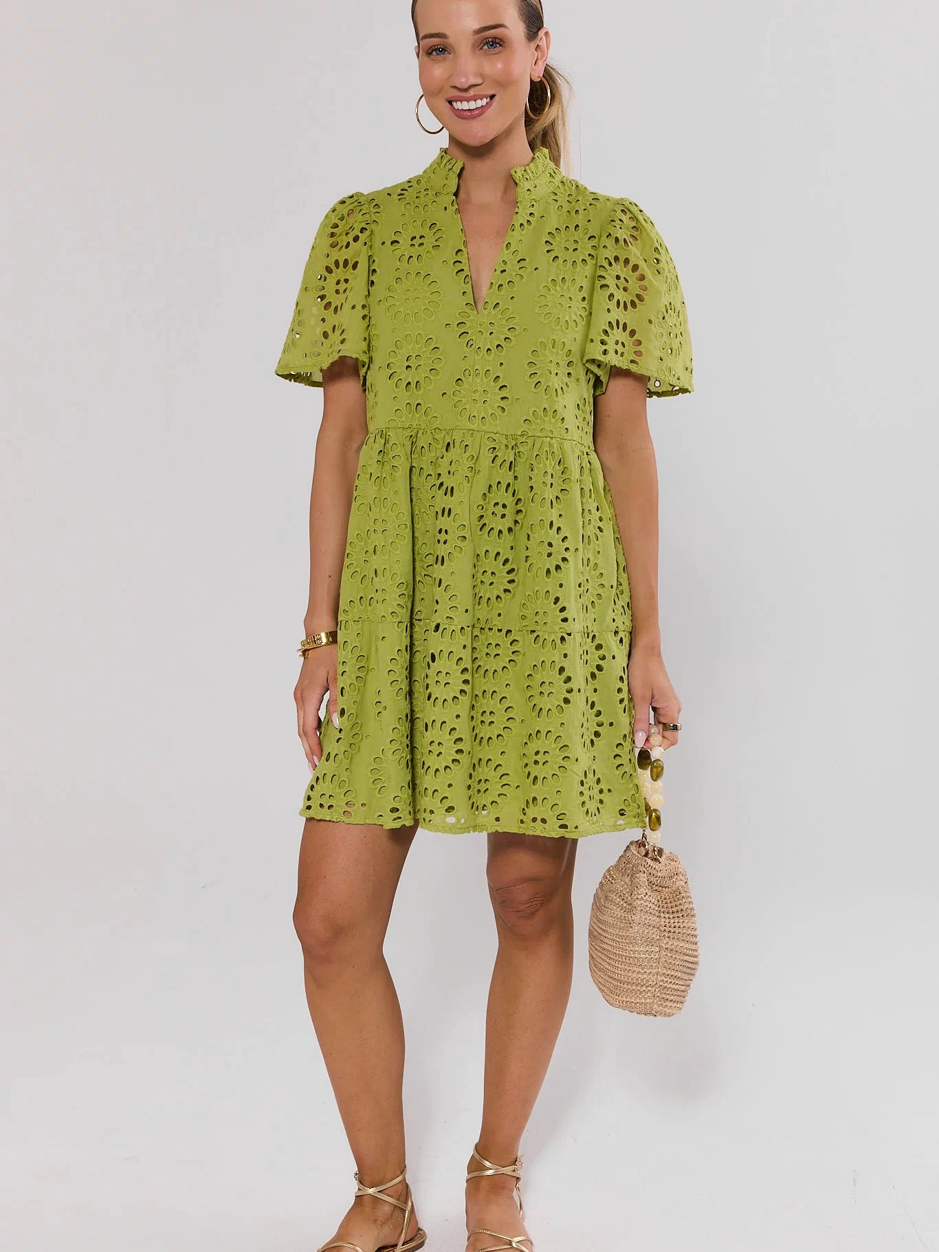 Womens Green Eyelet Short Dress Styled with Strappy Sandals and Woven Bag | Avara