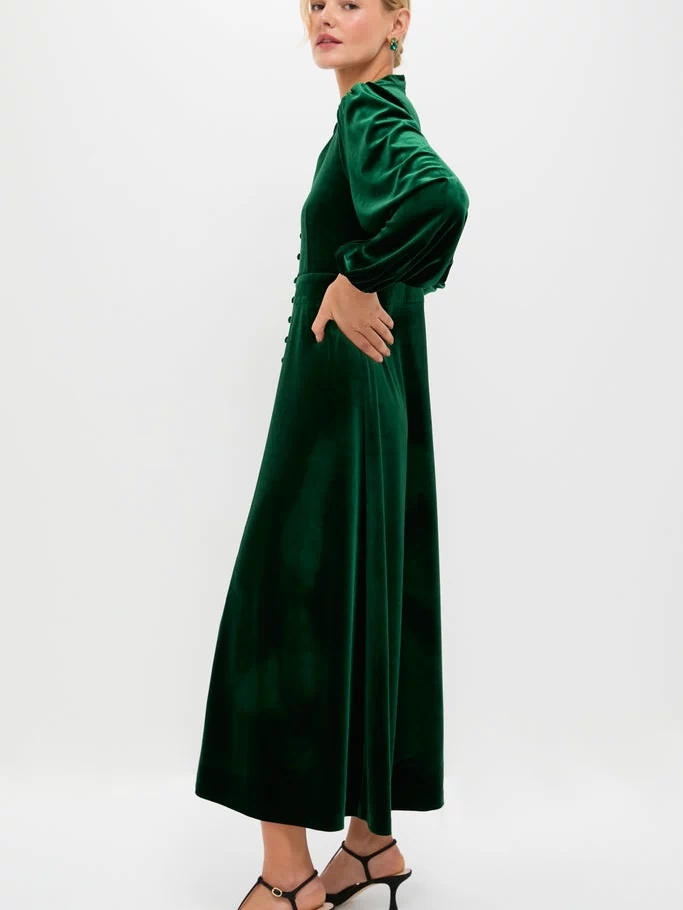 Green Velvet Serena Dress: A classic, high-end velvet maxi with effortless balloon sleeves and a fitted waist, styled with fun slingback heels and earrings.
