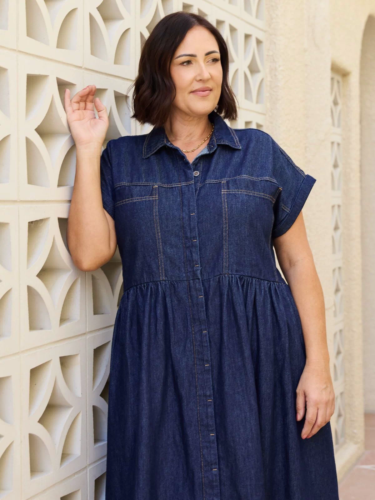 Harper denim dress in indigo, front view on petite model, midi length, button‑front shirtdress silhouette