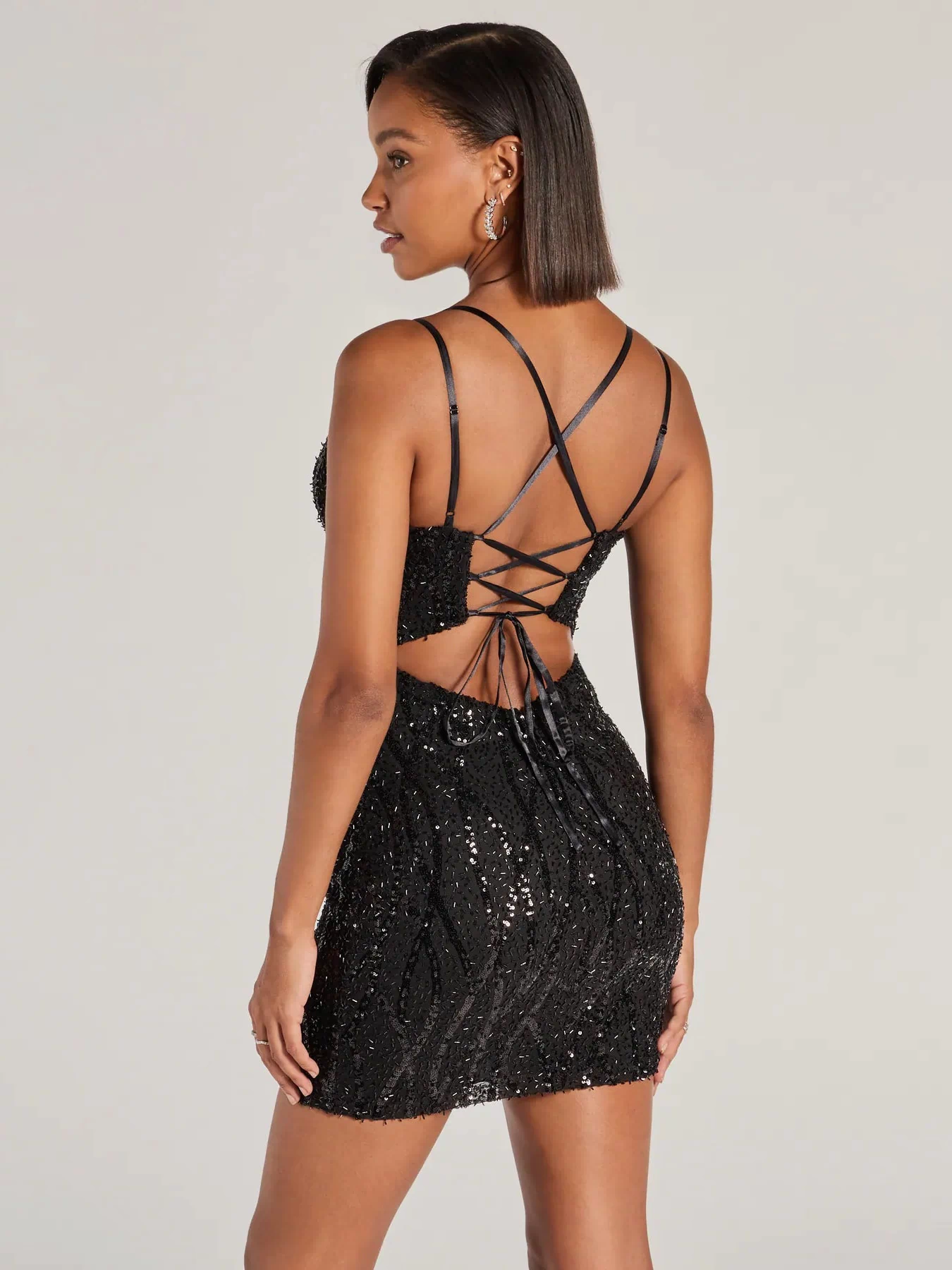 Style your seasonal looks with the Hartley Lace-Up Sequin Mesh Bodycon Mini Dress, a trend-right, black Windsor dress designed for any plan on your calendar with new and unqiue details.