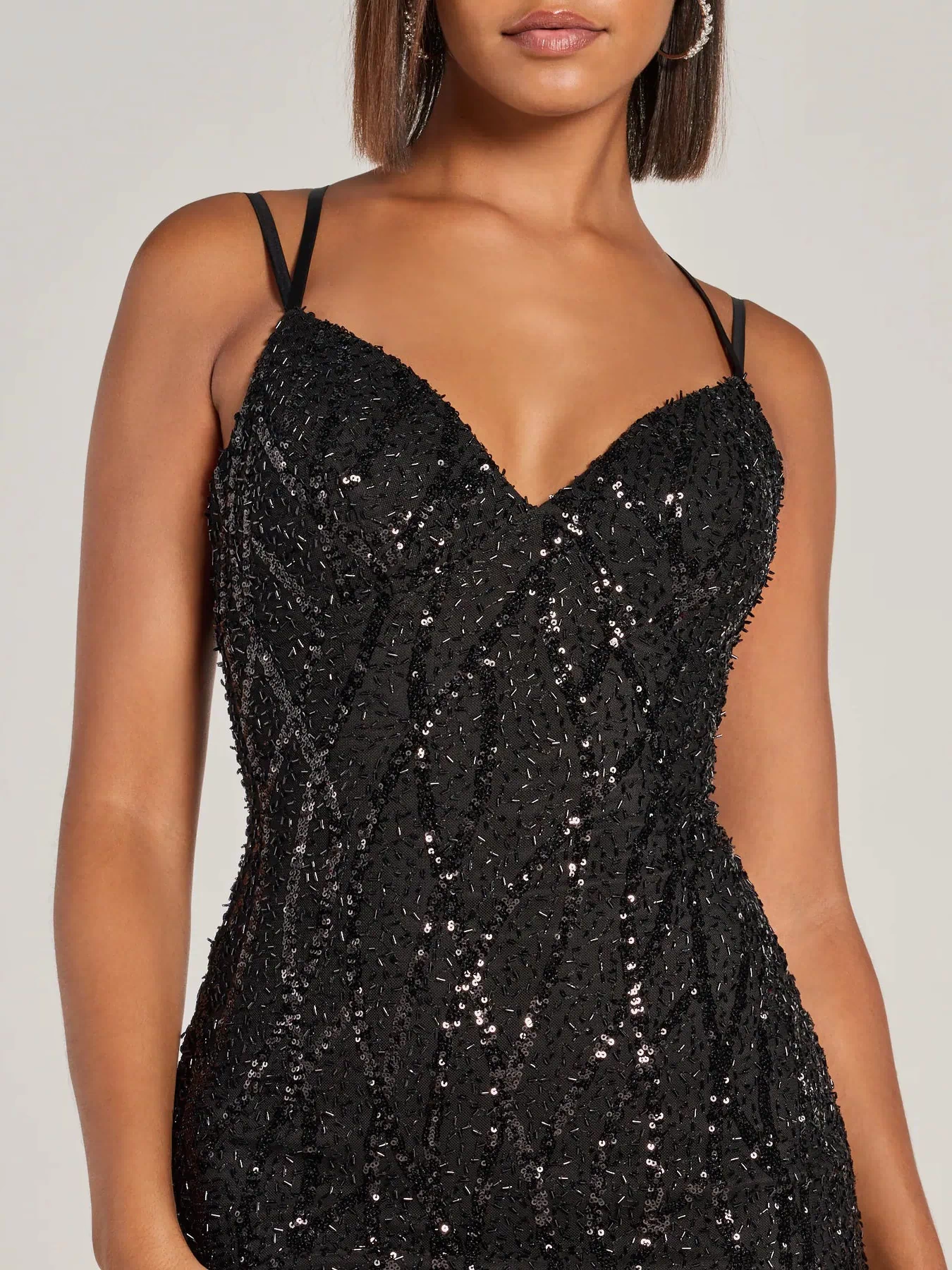 Celebrate in style with the Hartley Lace-Up Sequin Mesh Bodycon Mini Dress, a black party dresses standout that brings bold, festive flair with playful and on-trend details.