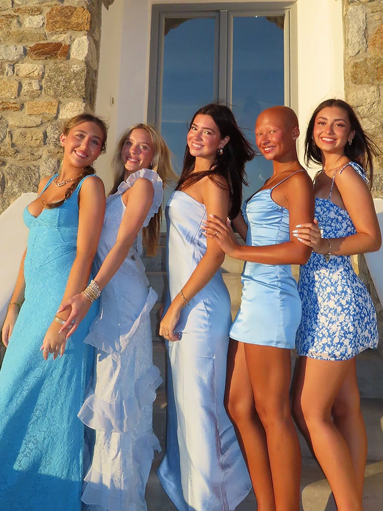 Side view of a light blue satin mini dress with thin spaghetti straps and a ruched bust