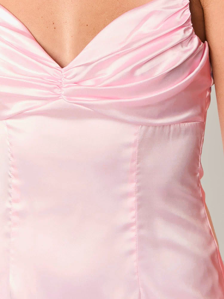 Close-up of the light pink satin cowl neck mini dress showing the ruched bust detail and bodice seams