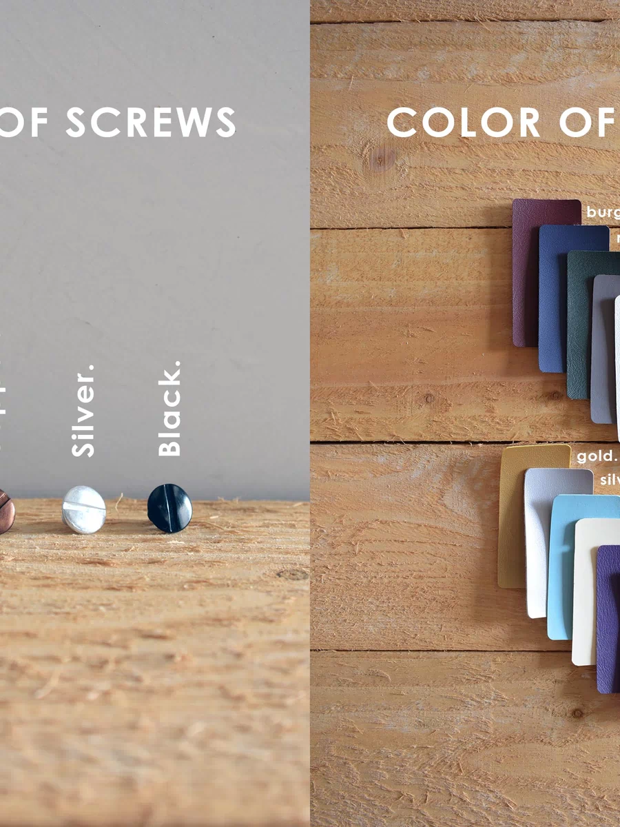 a wooden table topped with different colored screws