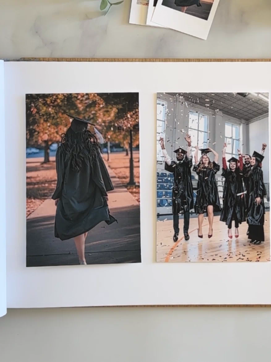 a book opened to a page with photos of graduates