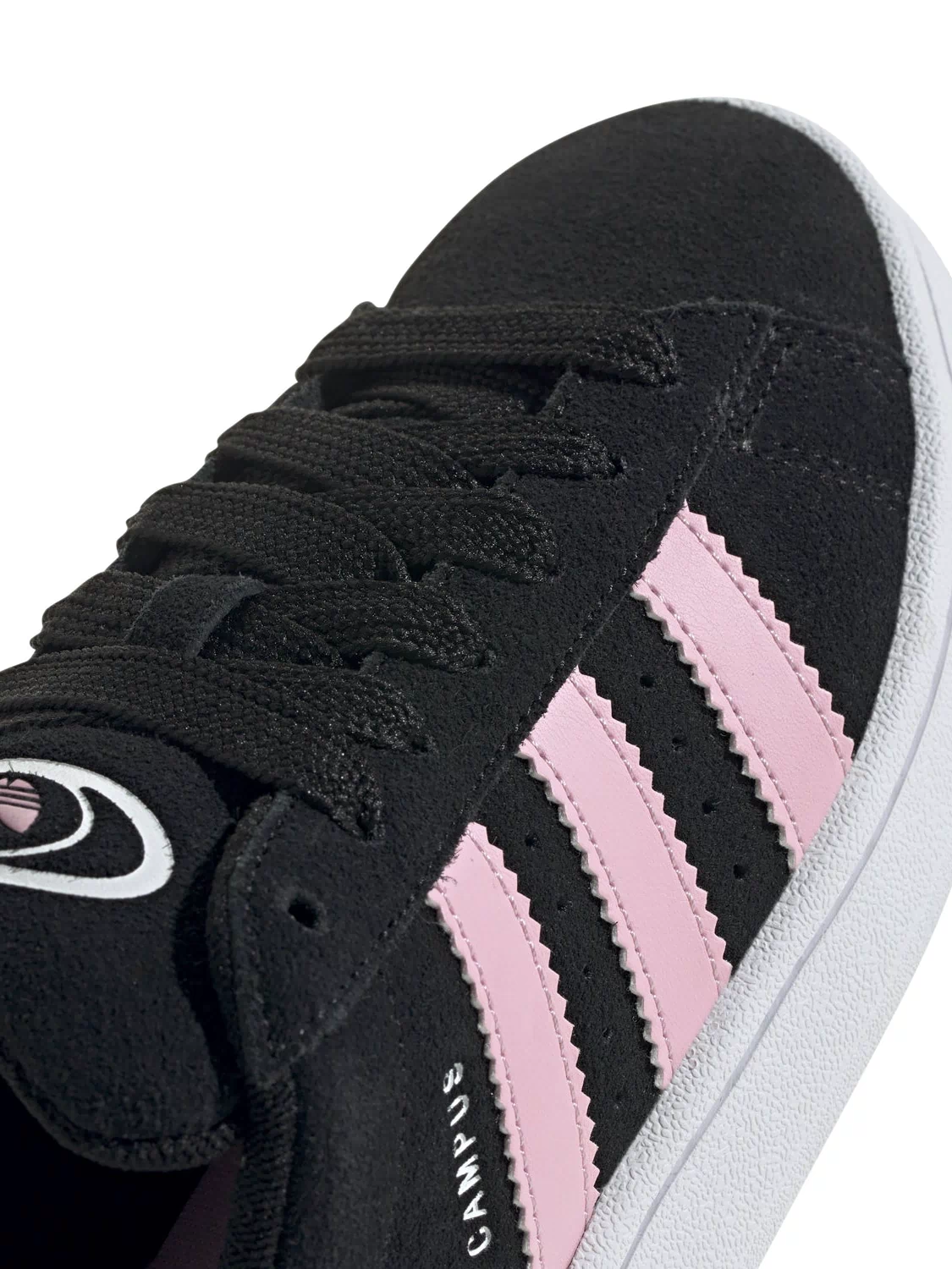 Close-up of black lace-up sneakers with pink triple stripes and adidas logo patch.