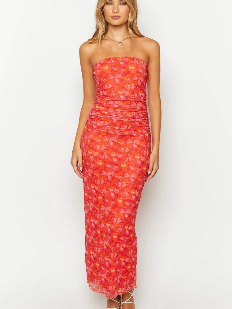 Front view of an orange floral print strapless maxi dress with extensive ruching on the bodice and body