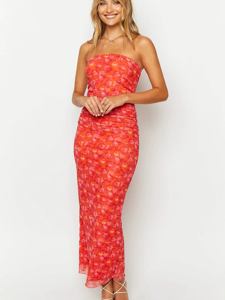 Front view of an orange and pink floral print strapless maxi dress with ruched side seams