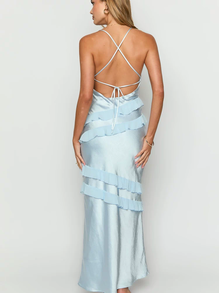 Rear view of a light blue satin maxi dress with criss-cross tie-back straps and tiered ruffles