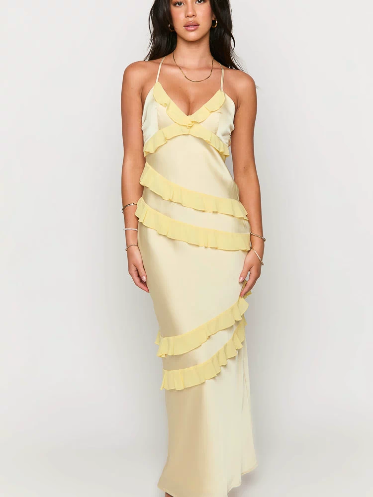 Pale yellow satin maxi dress with a V-neck, spaghetti straps, and cascading sheer yellow ruffles