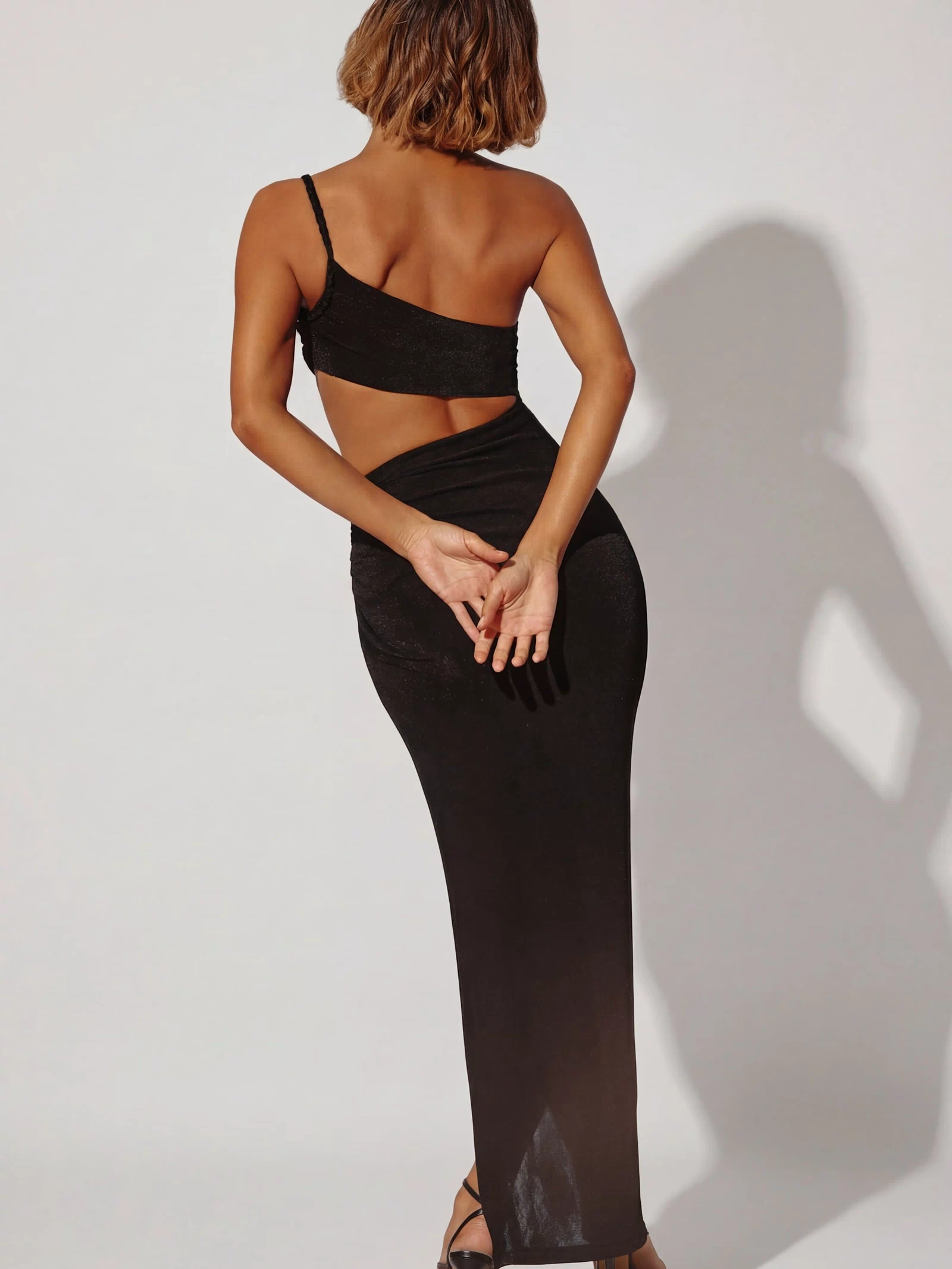 Oh Polly's Cristal wearing the Ishtar Maxi Dress in Black Textured Jersey fabric perfect for elegant evening events