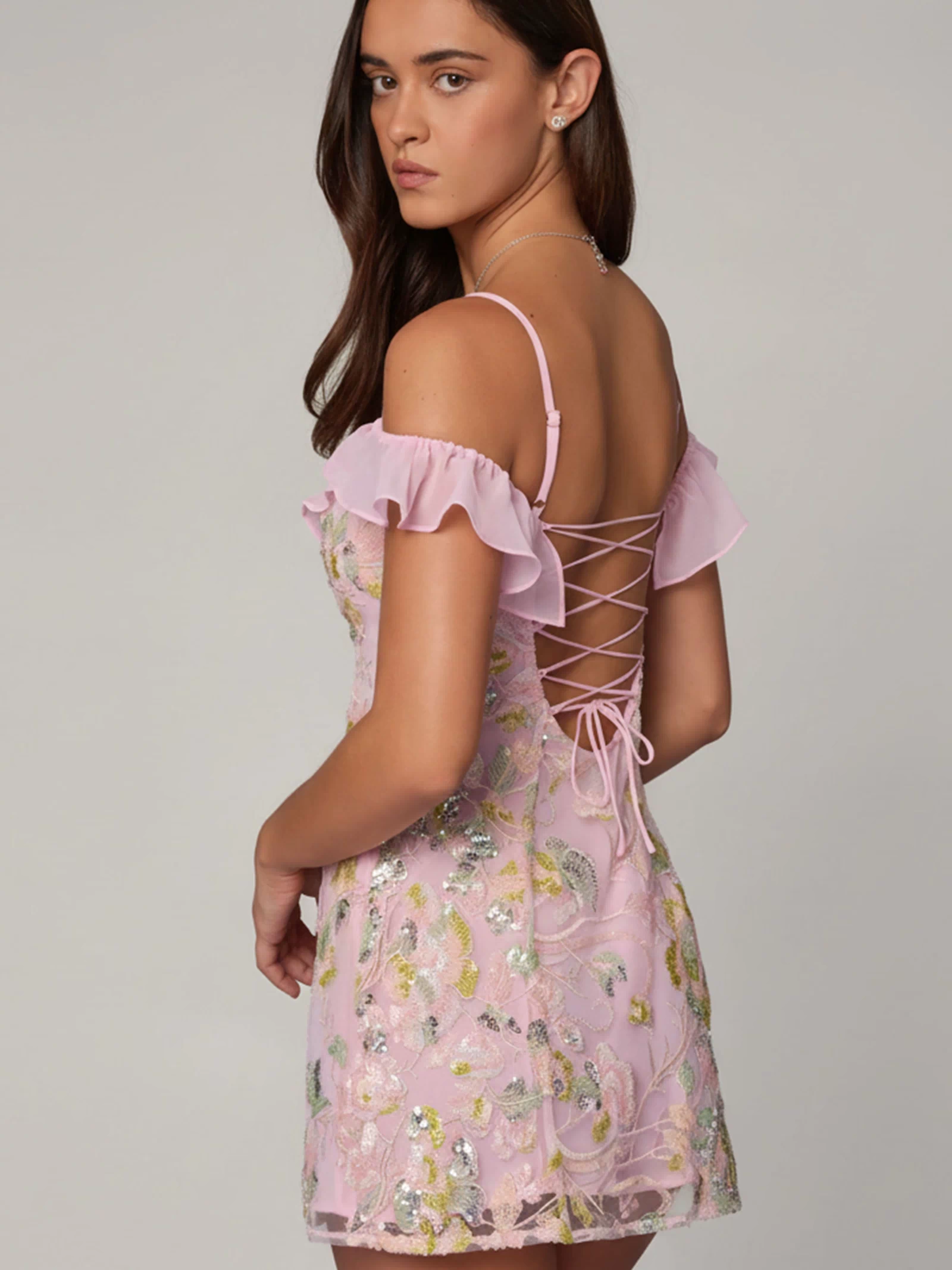 Oh Polly model Roberta wearing the Jacira Mini Dress in Ballet Pink Sequin, Chiffon fabric perfect for evening dinners