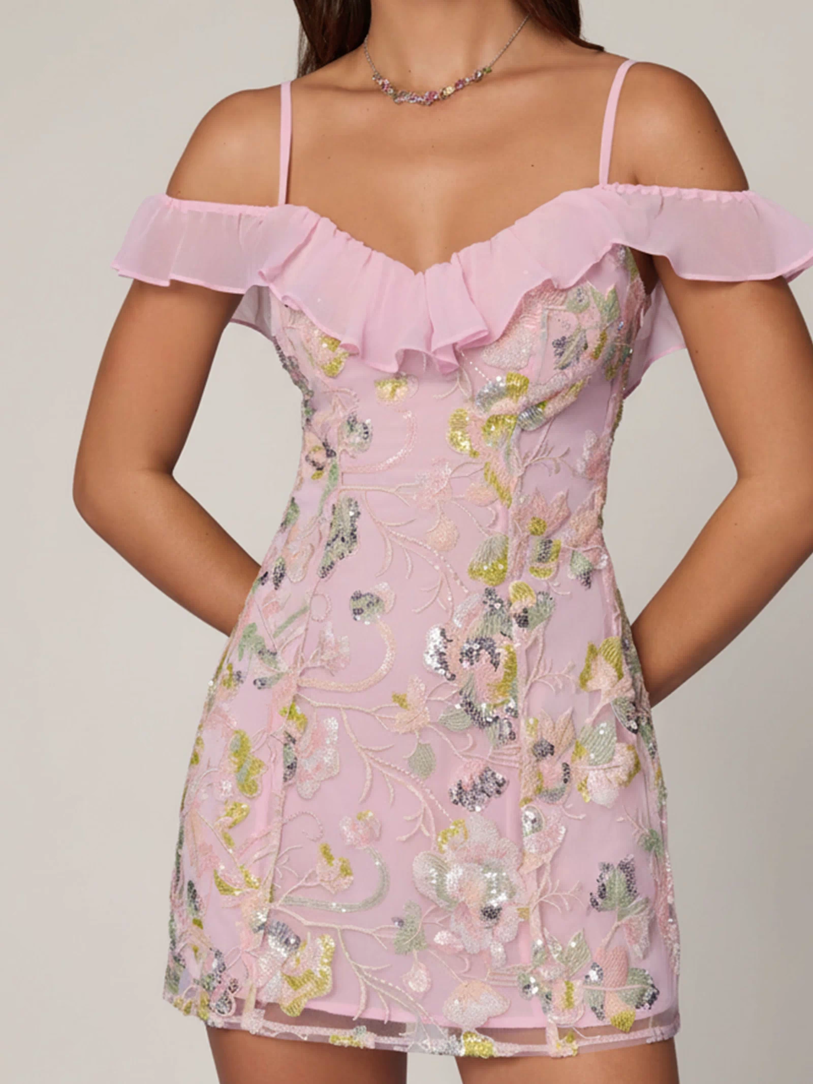Oh Polly model Roberta wearing the Jacira Mini Dress in Ballet Pink Sequin, Chiffon fabric perfect for wedding guests