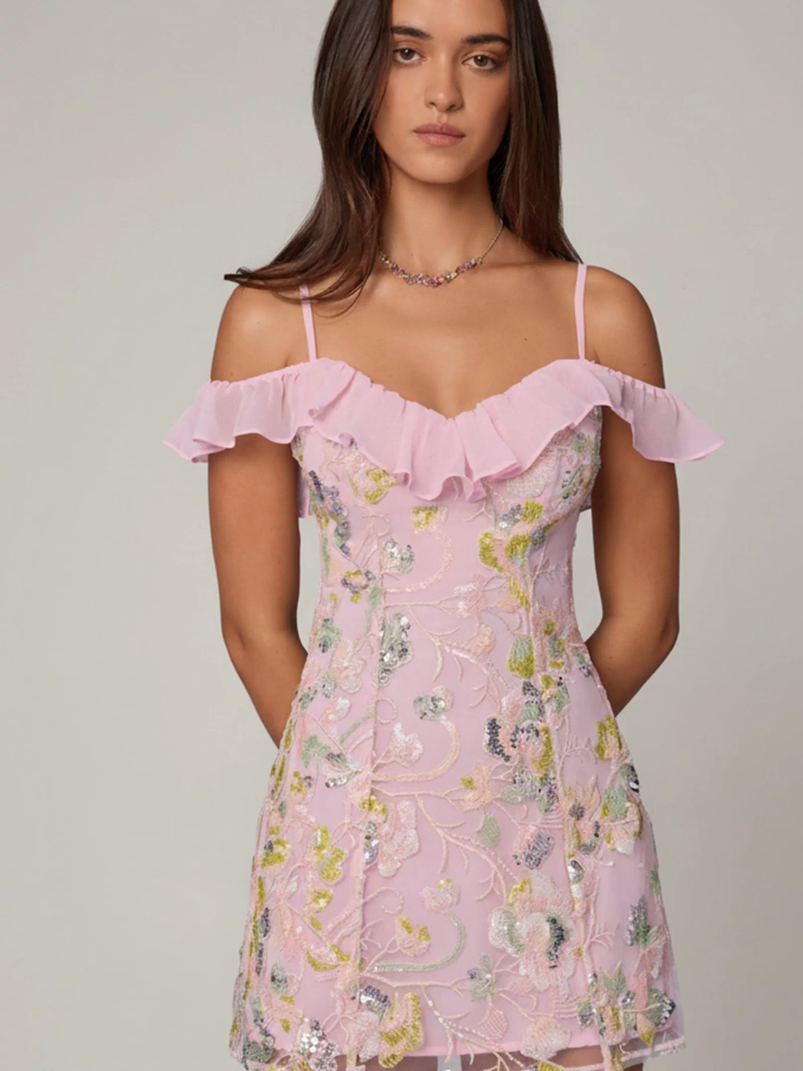 Oh Polly model Roberta wearing the Jacira Mini Dress in Ballet Pink Sequin, Chiffon fabric perfect for holiday events