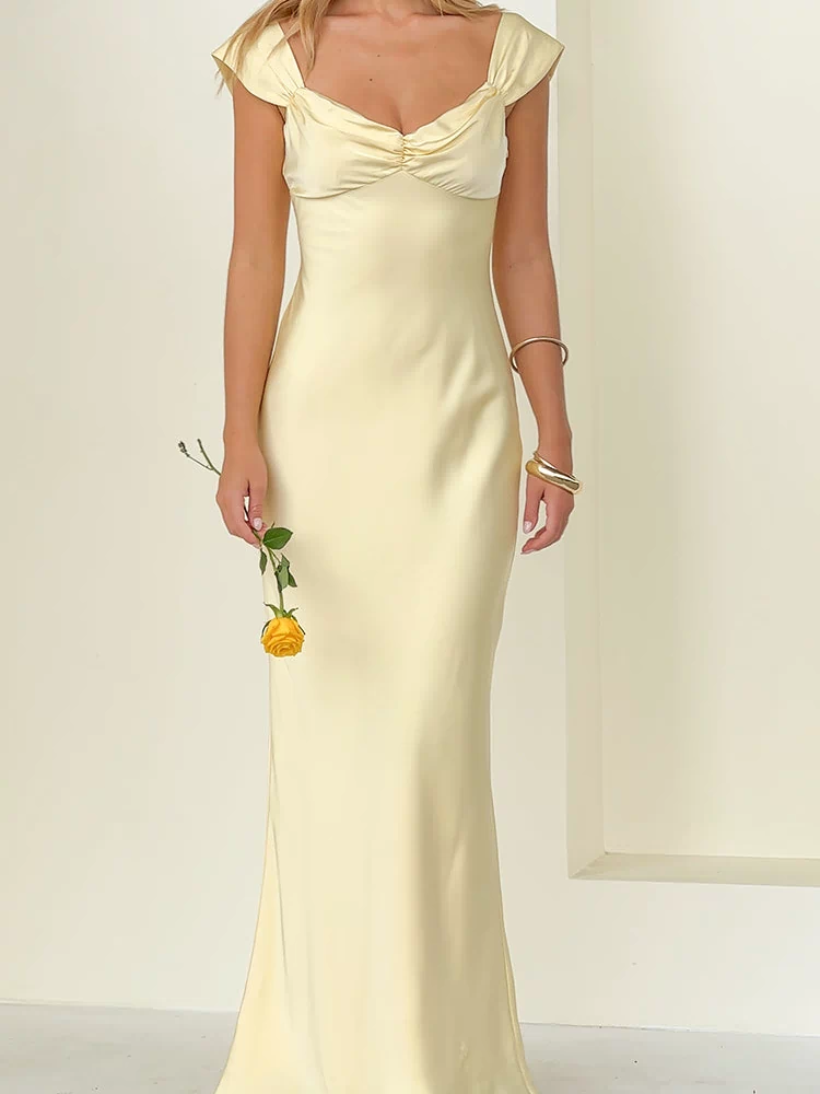 Front view of a yellow satin maxi dress featuring a ruched sweetheart neckline and draped off-shoulder cap sleeves