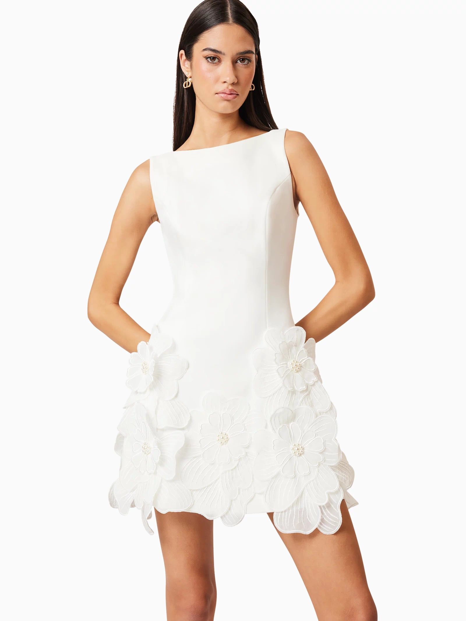 Brunette model wearing Janelle Mini Dress In White close up shot