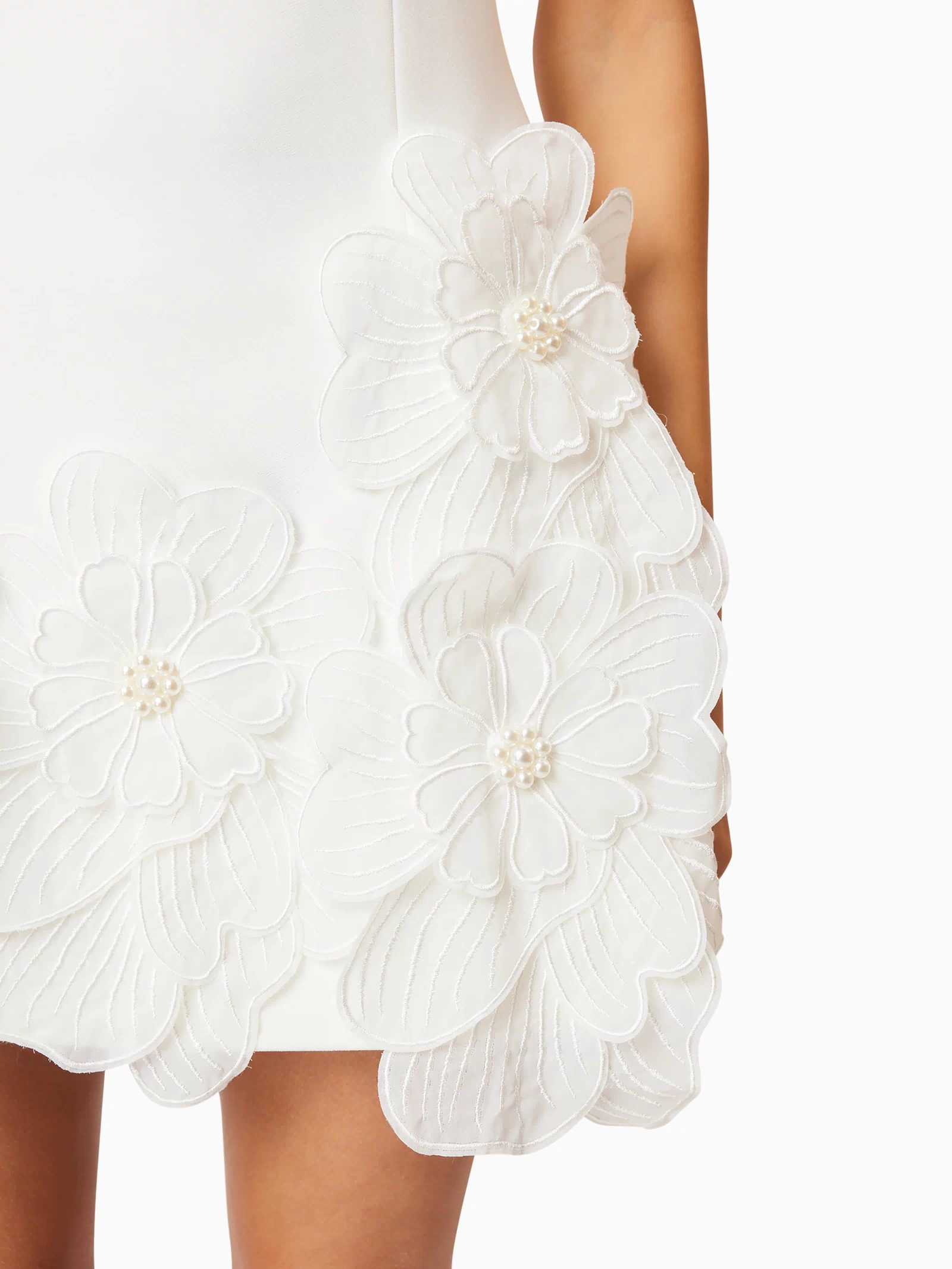 Brunette model wearing Janelle Mini Dress In White detail shot