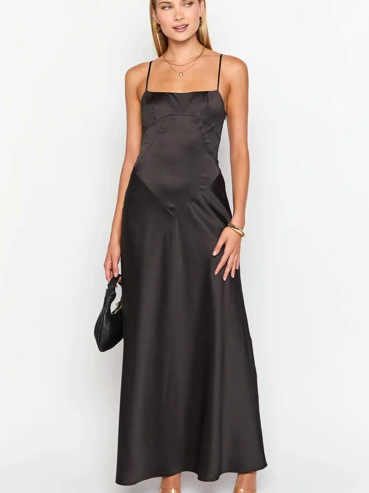 Black satin maxi dress with a square neckline, thin spaghetti straps, and V-shaped paneling on the bodice