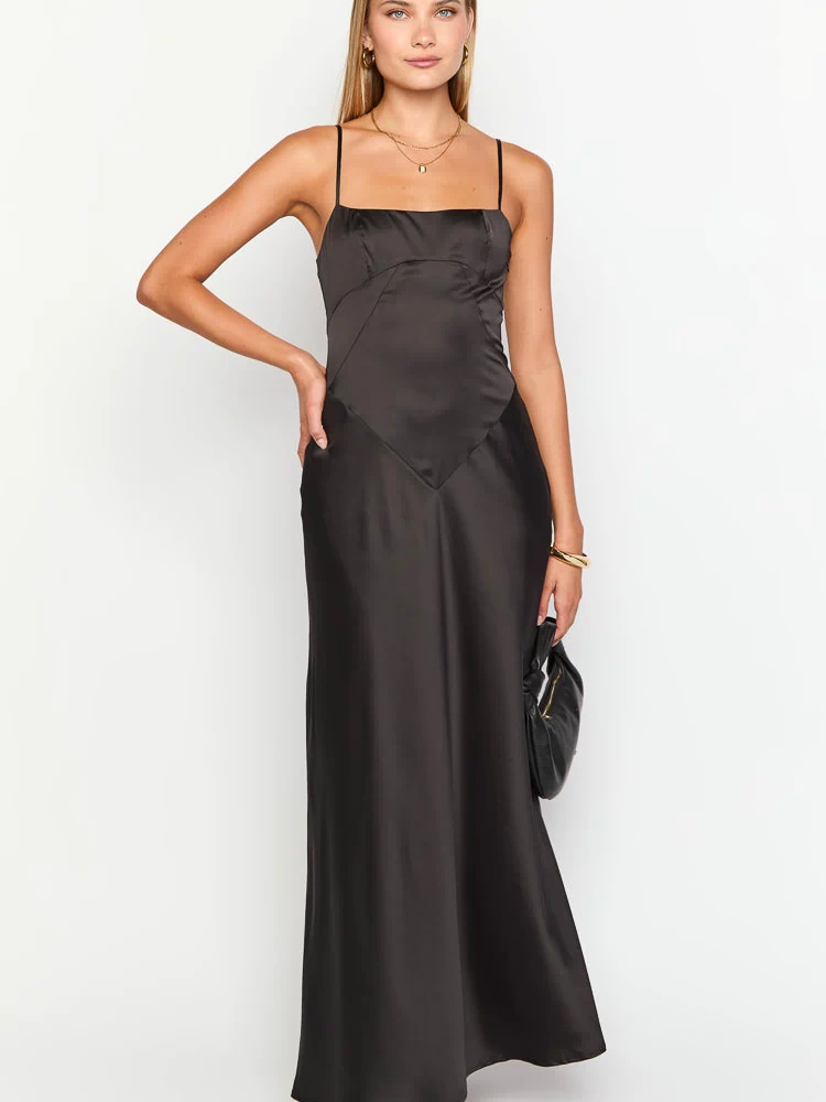 Black satin maxi dress with a square neckline, thin spaghetti straps, and V-shaped seam detail at the waist