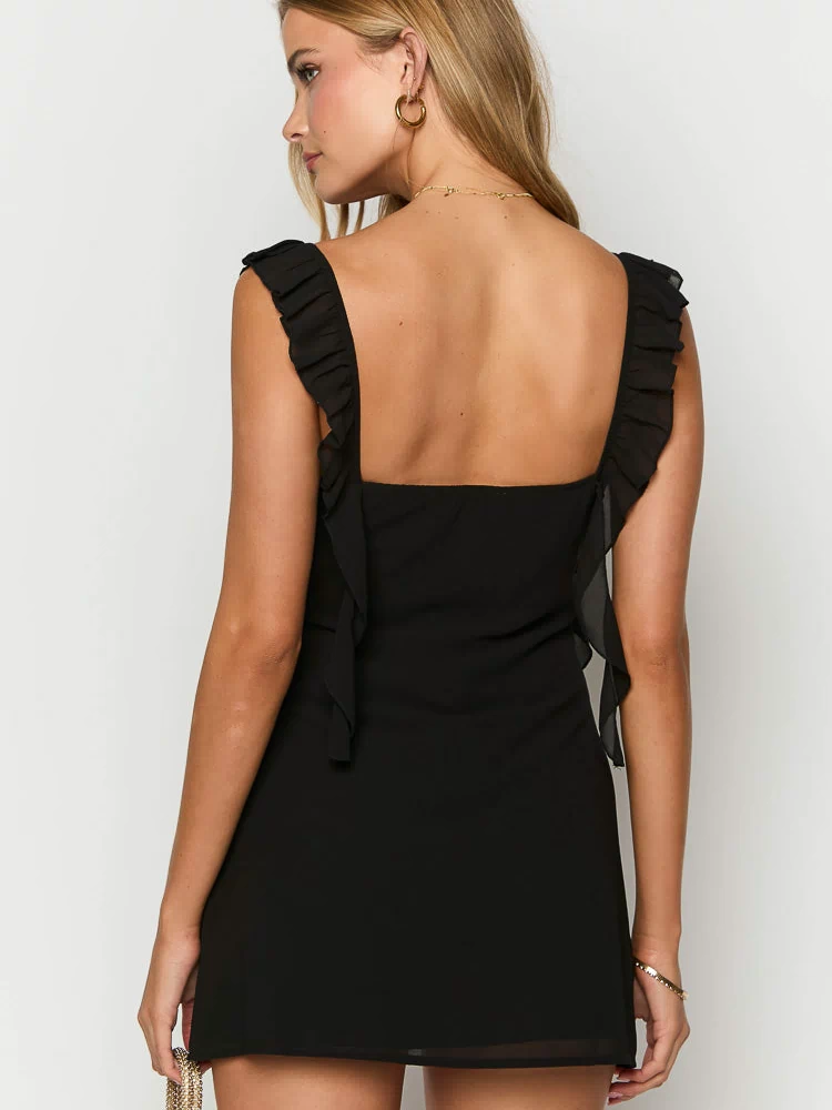 Back view of a black chiffon mini dress with a square neckline and ruffled shoulder straps