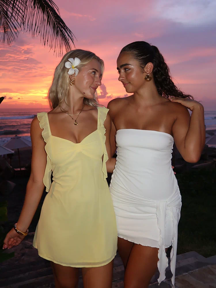 Flowy yellow chiffon mini dress with ruffled straps and tie-front sweetheart neckline evening