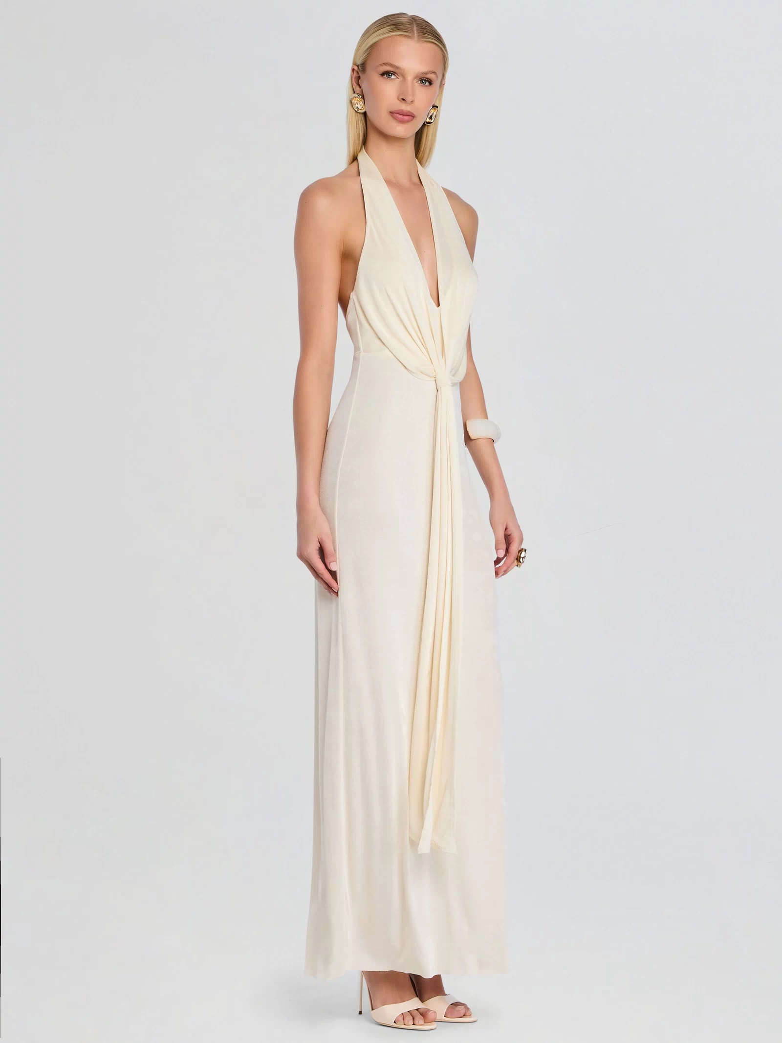 Ivory Kayla Maxi Dress with halter neck and front knot drape on a model