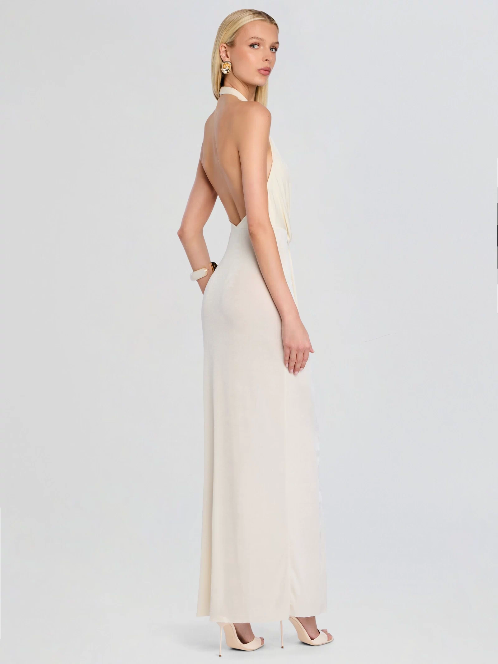 Back view of ivory Kayla Maxi Dress featuring a halter neckline and open back