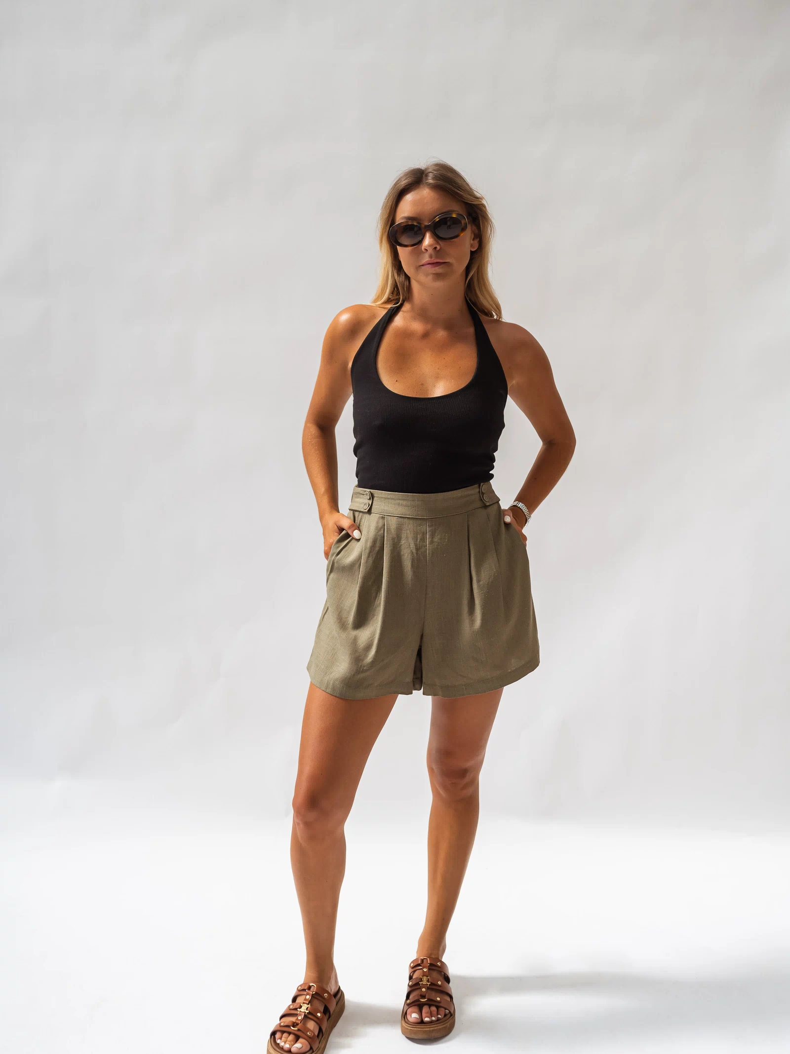 Khaki Lison Shorts complete outfit look, seated pose