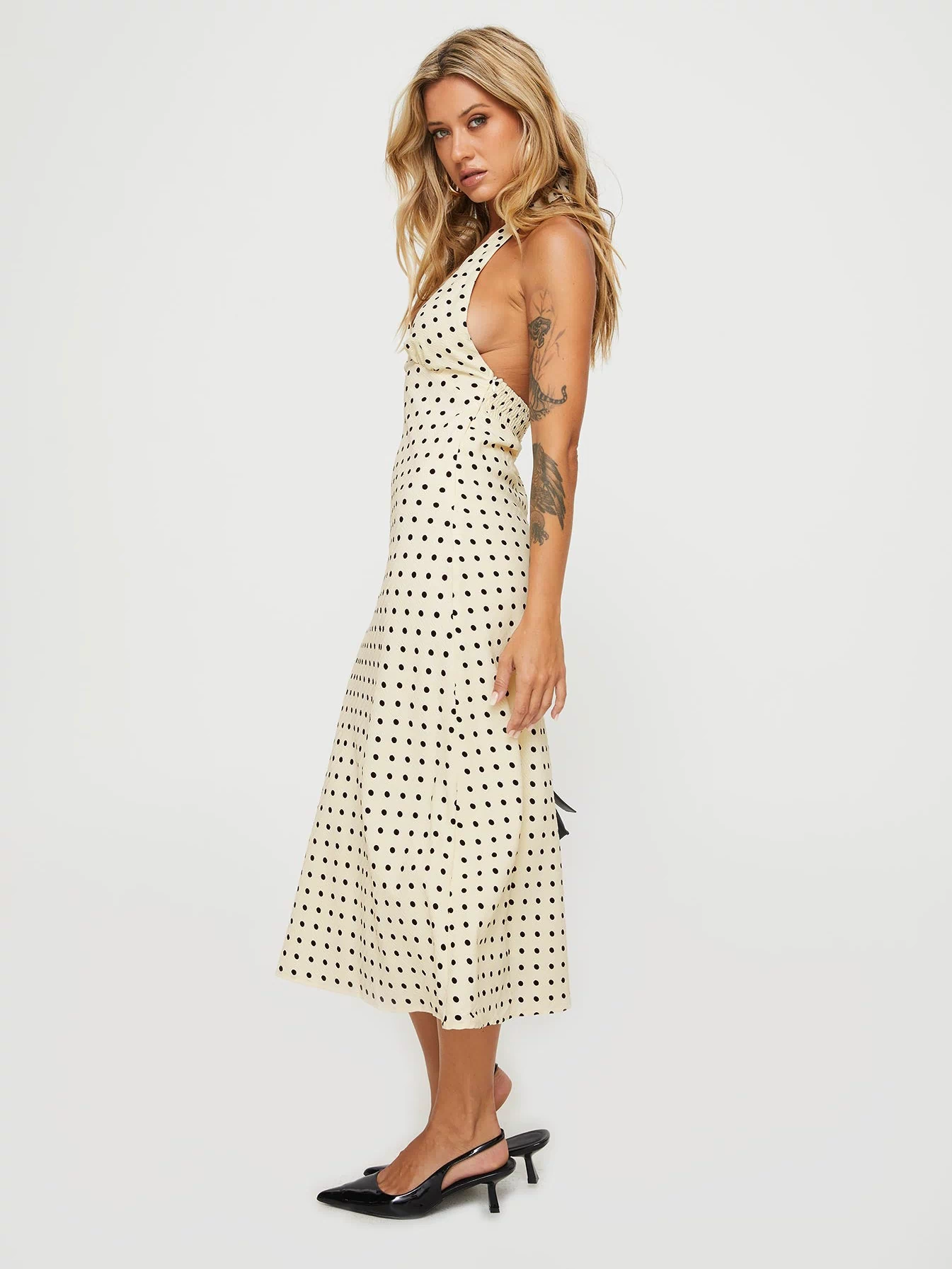 side view of model wearing Princess Polly Kimbelle Halter Maxi Dress Cream / Polka Dot Plunger 