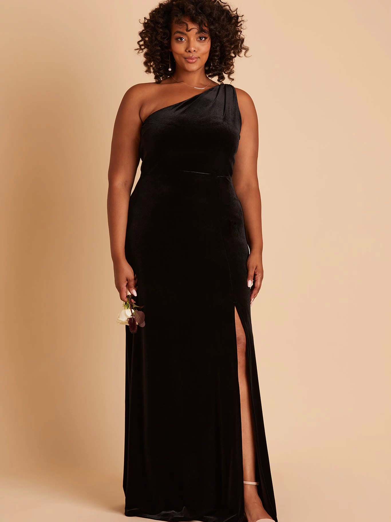 Kira plus size bridesmaid dress with slit in black velvet by Birdy Grey, front view