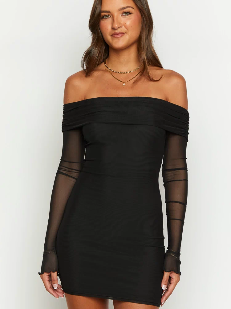 Close-up of the black off-shoulder mini dress with ruched mesh neckline and sheer long sleeves with frilled cuffs