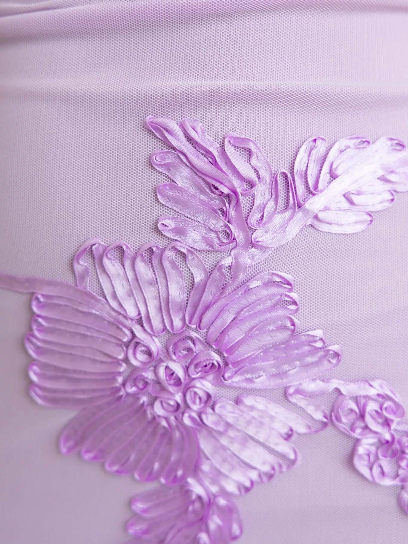 Close-up of embroidered floral design on the Korren Maxi Dress in lavender mesh fabric.
