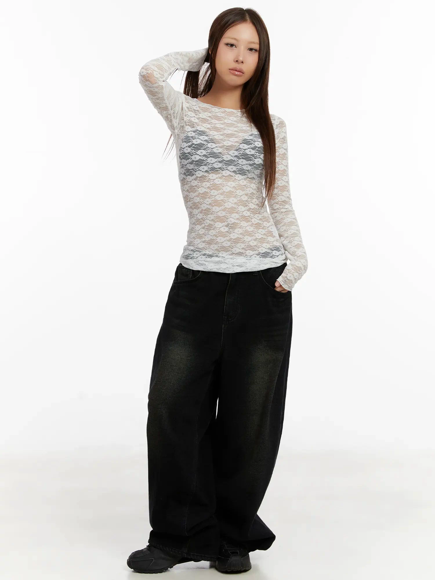 Lace Sheer Long Sleeve Top CD512 in white, front full-length view on model with hand raised, U-neck sheer floral lace slim fit, paired with black wide-leg baggy jeans.