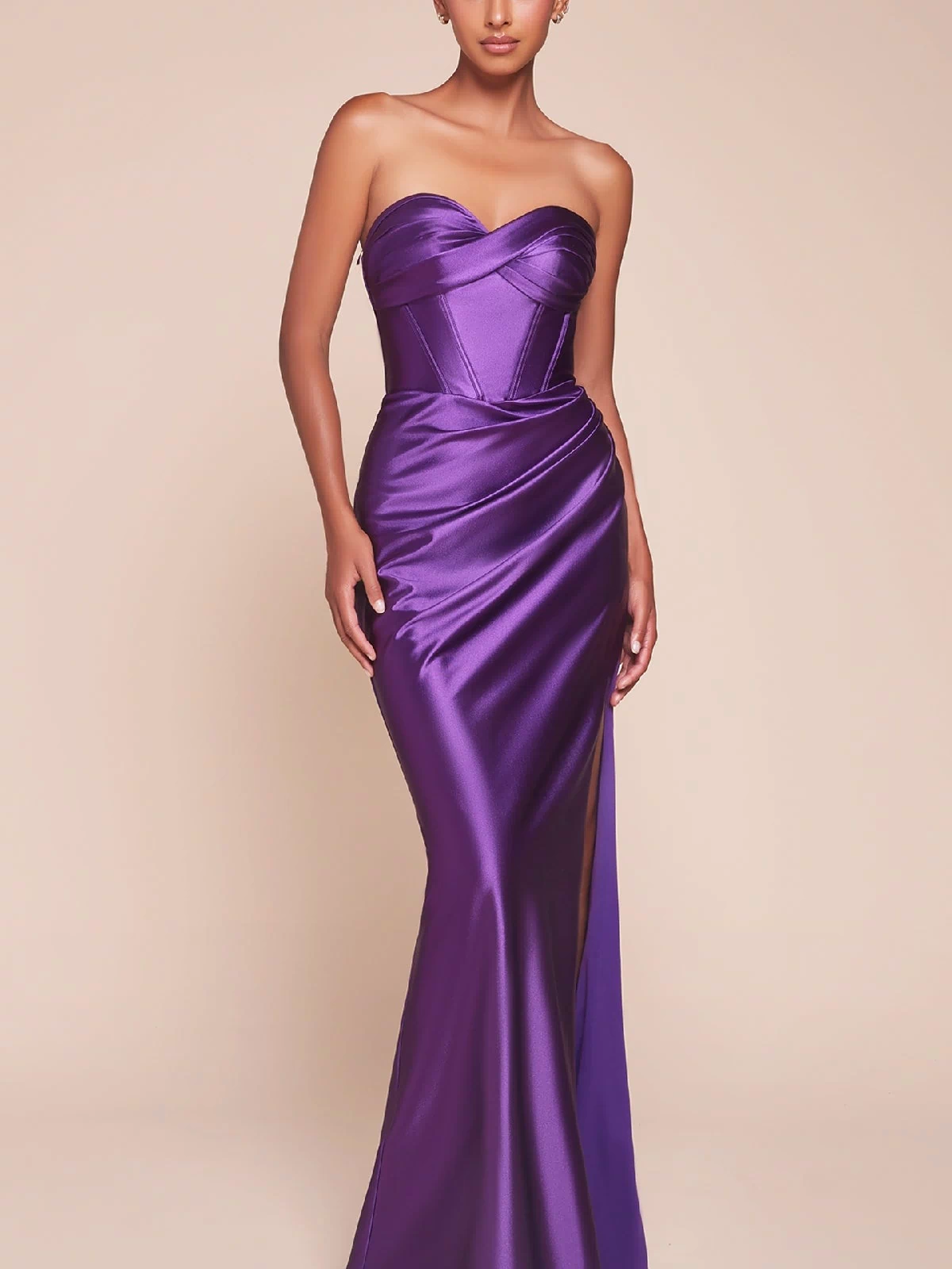 A woman models the Boned-Corset Strapless Long Prom Dress CD338 in purple satin, with a sweetheart neckline, boned corset bodice, and high slit.